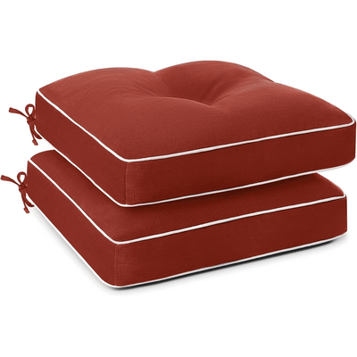 Two red cushioned ottomans with ties of Favoyard