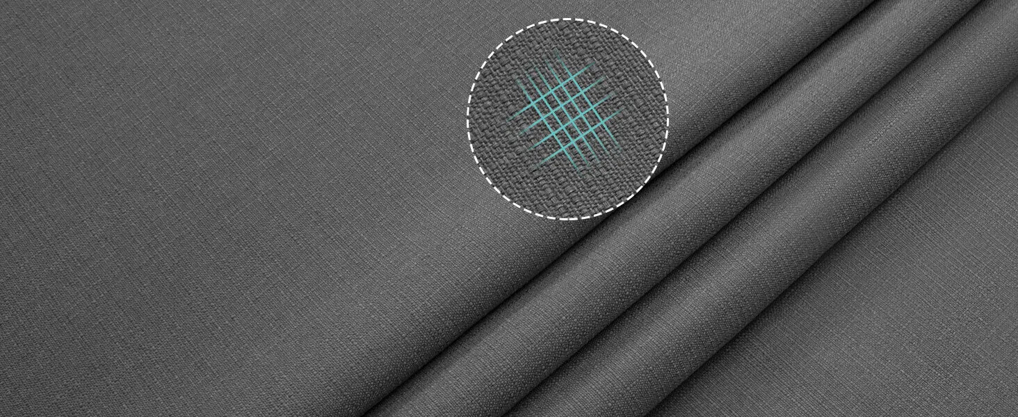Close-up of gray fabric with a circular detail showing a textured pattern.